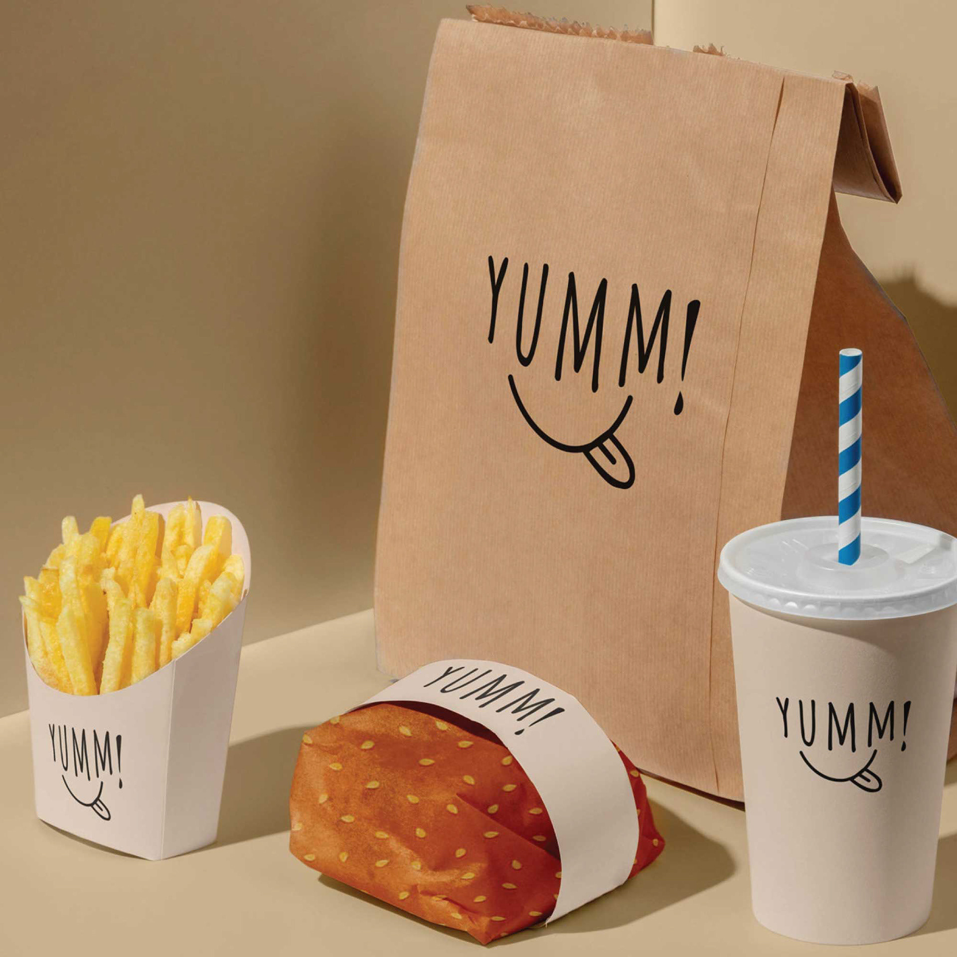A food packaging set featuring the Yumm! wordmark.